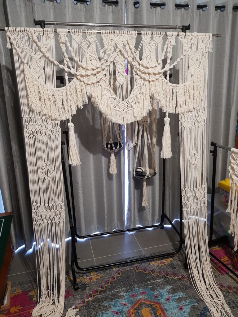 Macrame Wedding Backdrop Beautiful macrame wedding backdrop made of natural cotton cords, featuring intricate knotwork, tassels, and a boho-chic design.