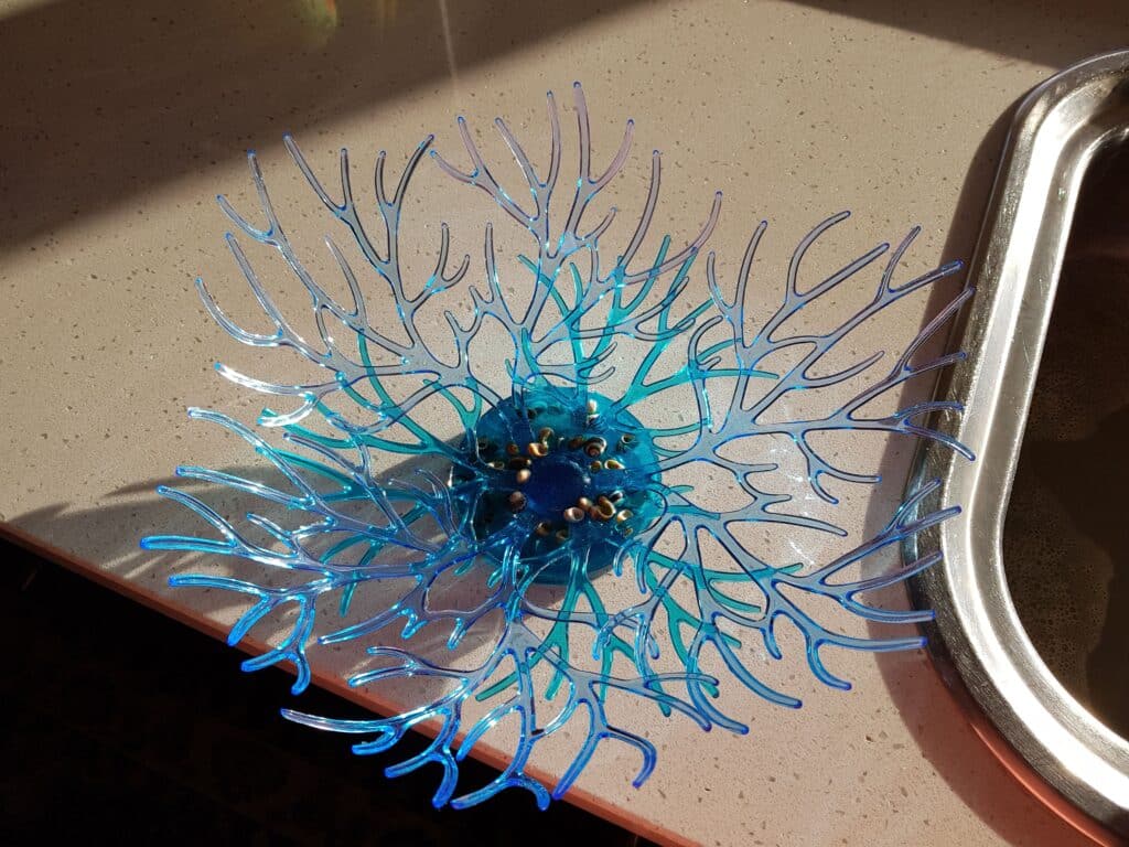 Resin Piece Intricate blue resin piece with branching design on countertop